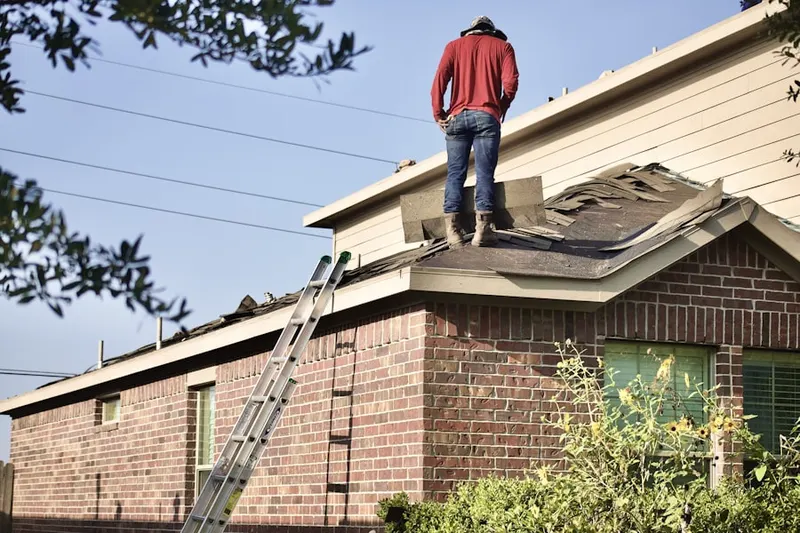 Professional roofer working on a residential roof in Sunset Lake Estates